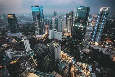 High angle view of modern buildings in city against sky