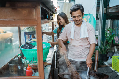 Side view of man working at market