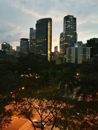 Buildings in city at dusk