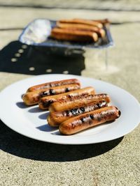 Close-up of sausage in plate on table