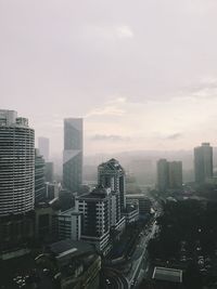 High angle view of buildings in city against sky