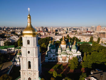 Panoramic view of buildings in city against clear sky