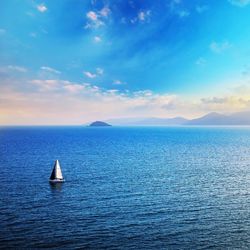 Sailboat sailing in sea against sky