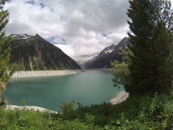 Scenic view of lake and mountains against sky