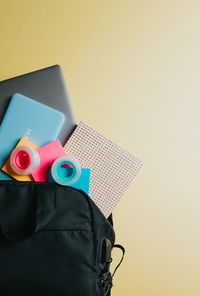 High angle view of personal accessories on pink background