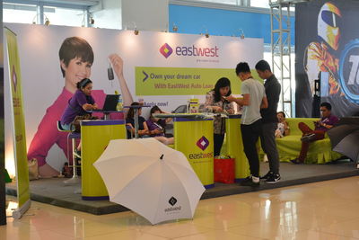 Rear view of people standing on table