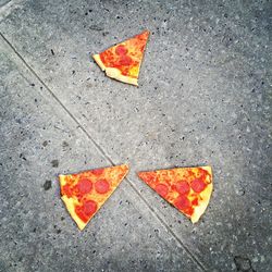 Close-up of yellow maple leaves on road