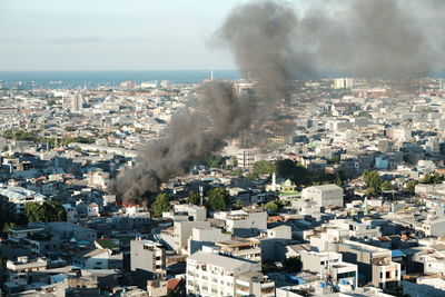 High angle view of buildings in city against sky