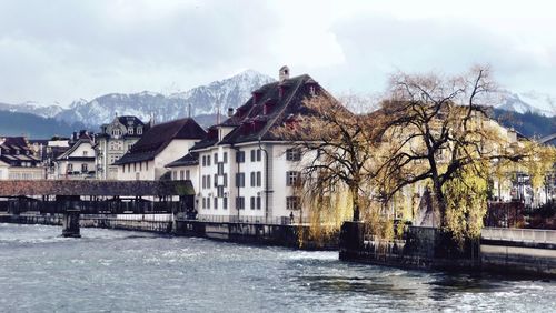 Buildings against cloudy sky