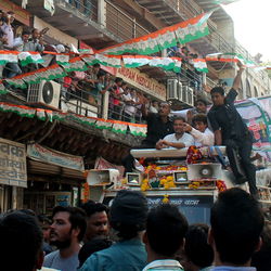 People at market stall in city