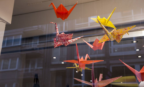 Low angle view of origami birds 