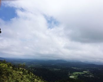 High angle view of countryside landscape against cloudy sky