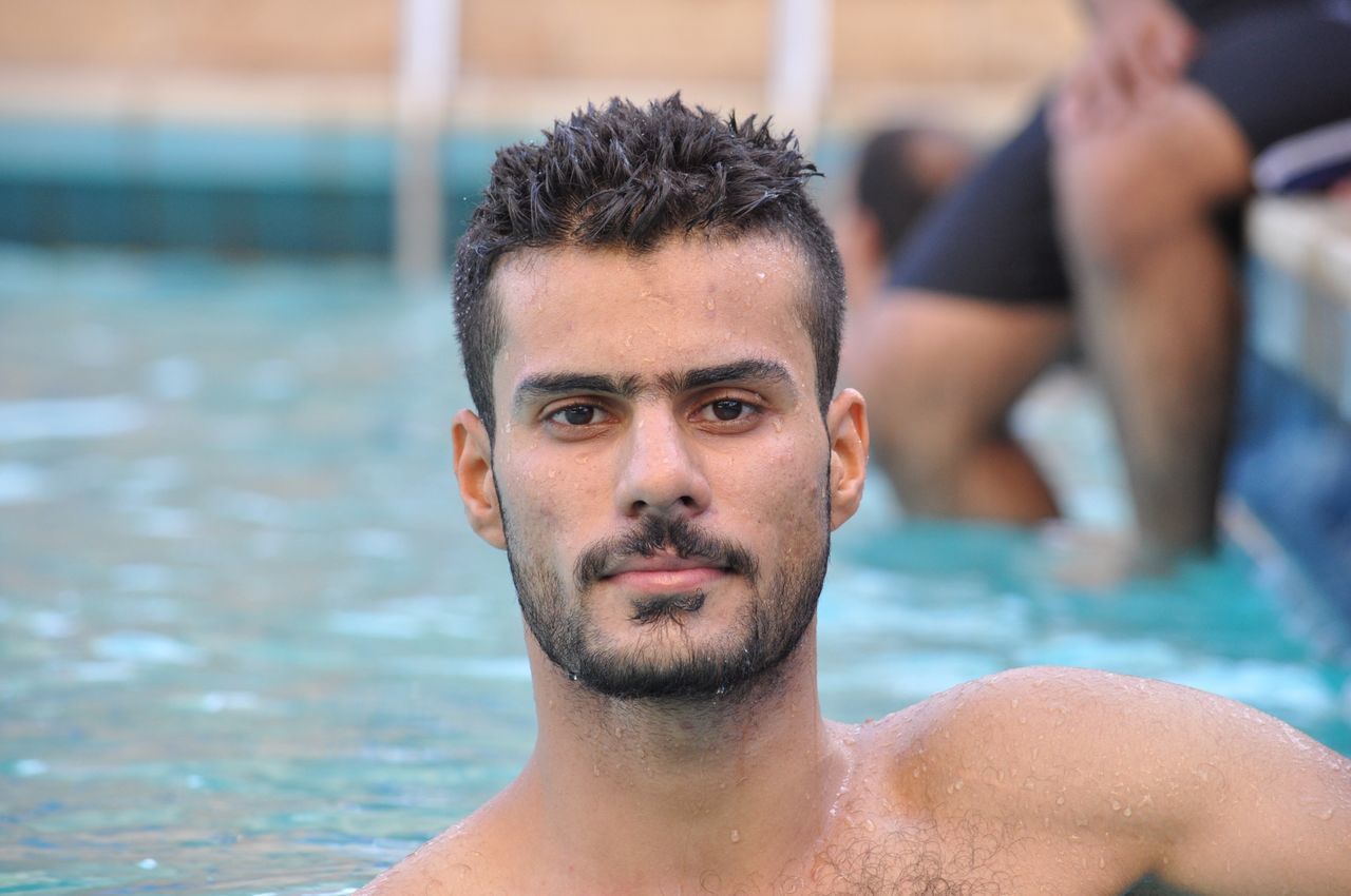 lifestyles, headshot, looking at camera, portrait, leisure activity, young men, focus on foreground, close-up, person, shirtless, front view, young adult, men, beard, human face, head and shoulders, water