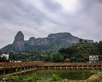 Scenic view of mountain against cloudy sky