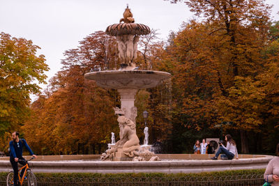 Statue in park during autumn