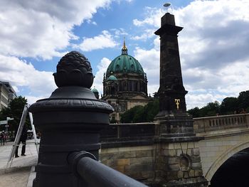 Low angle view of historic building against cloudy sky