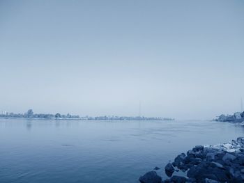 Scenic view of sea against sky during winter