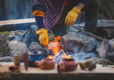 Reflection of man on barbecue grill