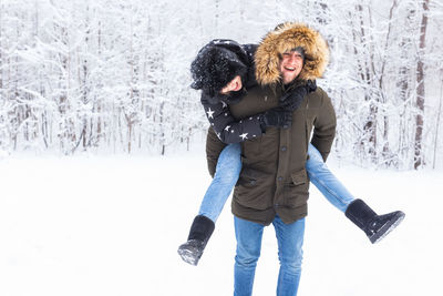 Friends standing in snow