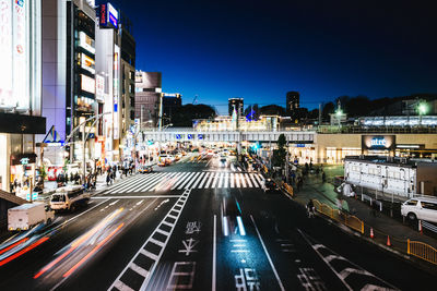 Light trails on road in city at night