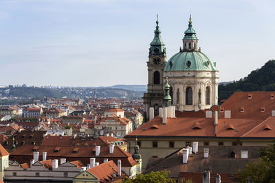 Buildings in city against sky