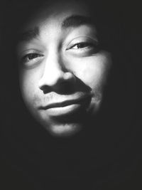 Close-up portrait of a serious young man