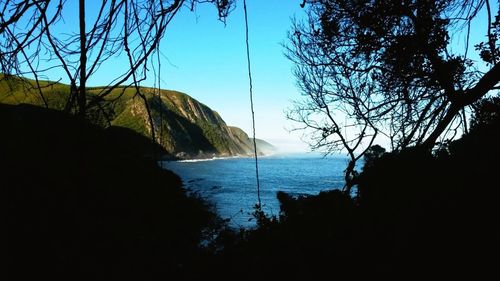 Scenic view of sea against clear blue sky