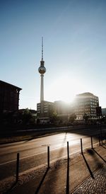 Tower in city against clear sky