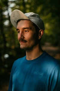 Portrait of young man standing outdoors