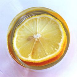 Close-up of lemon slice on white background