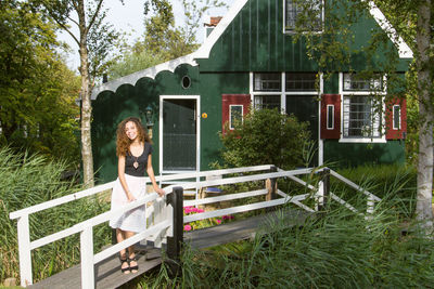 Woman in front of building