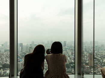 View of cityscape through window