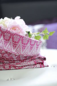 Close-up of pink flower on table