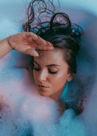 Beautiful woman bathing in bathtub
