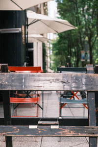 Empty chairs and table in outdoors cafe