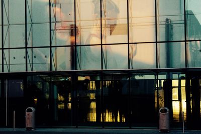 Illuminated building seen through window