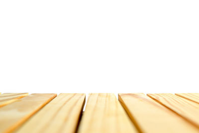 Close-up of wooden plank against white background