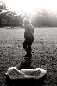 Rear view of girl on field