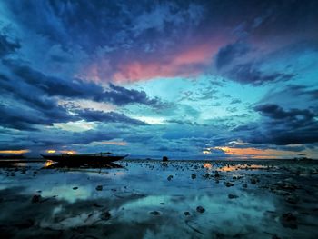 Scenic view of sea against dramatic sky