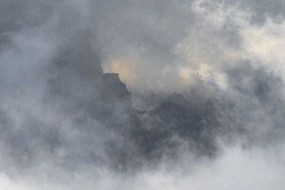 Low angle view of smoke against sky