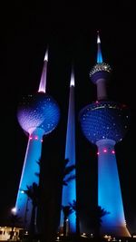Low angle view of modern building against sky at night