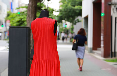 Red clothes and pedestrians on city streets