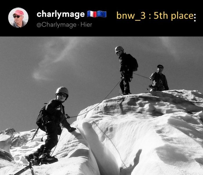 GROUP OF PEOPLE ON SNOW COVERED MOUNTAINS