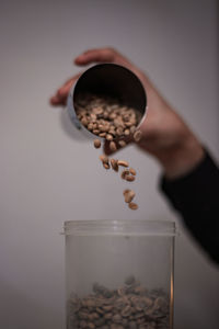 Close-up of hand holding coffee cup