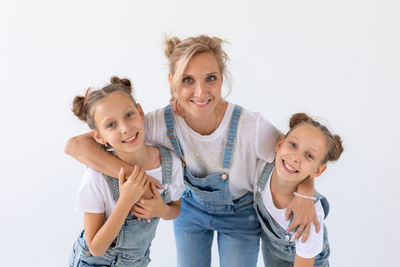 Portrait of a smiling girl over white background