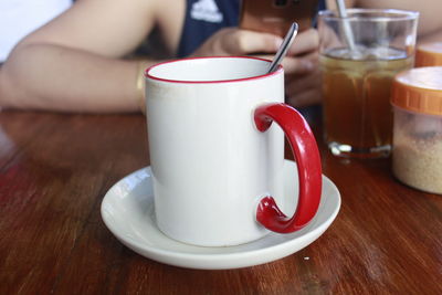 Close-up of coffee cup on table