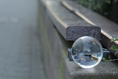 Close-up of vintage car on metal railing