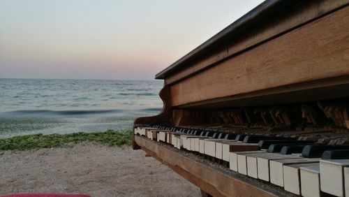 Close-up of beach against clear sky