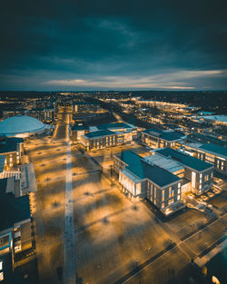 High angle view of illuminated cityscape against sky at night