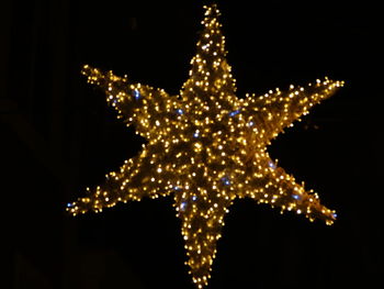 Illuminated christmas tree at night